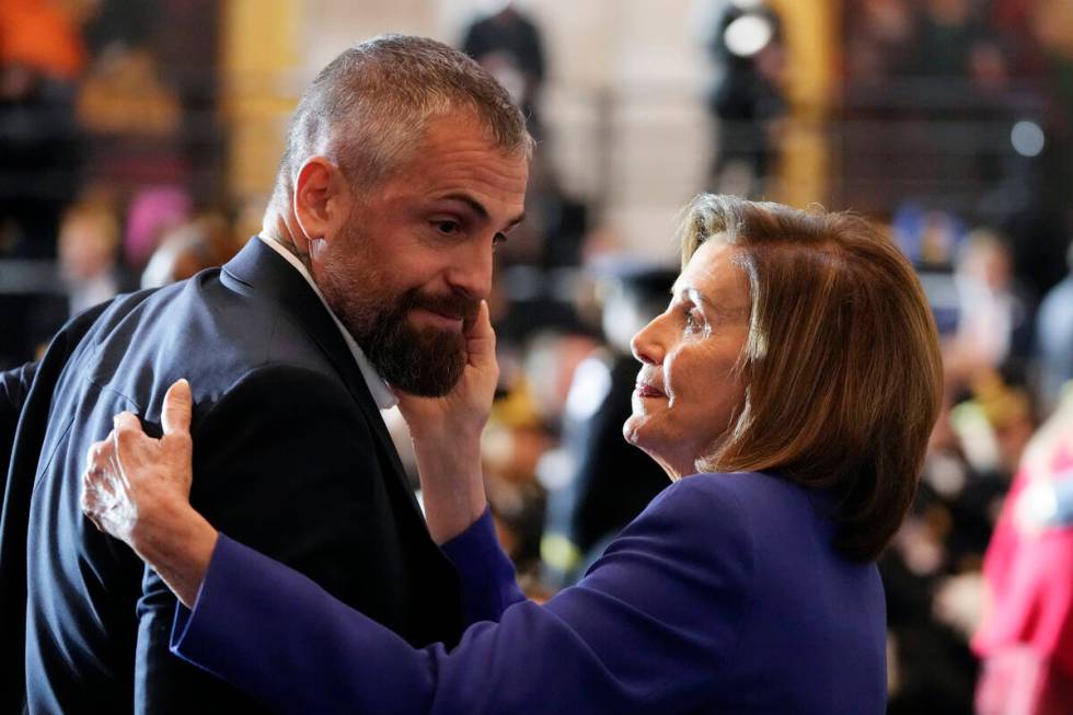 Speaker of the House Nancy Pelosi of Calif., embraces former Washington Metropolitan Police Dep ...