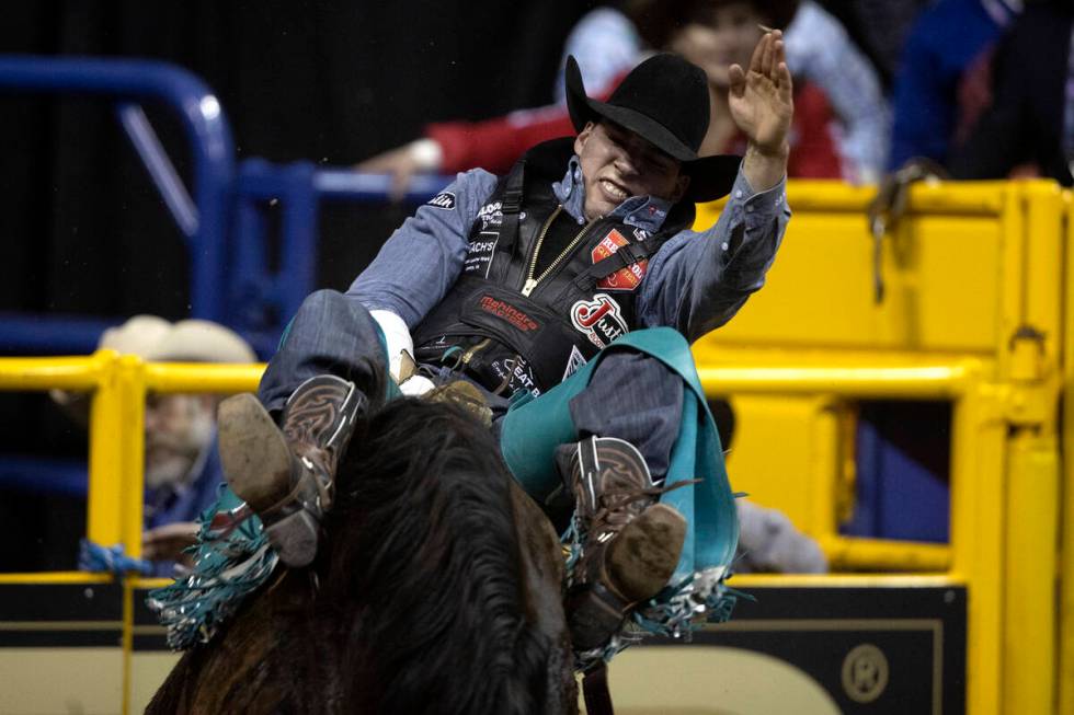 Jess Pope, of Waverly, Kan., competes in bareback riding during the sixth go-round of the Natio ...