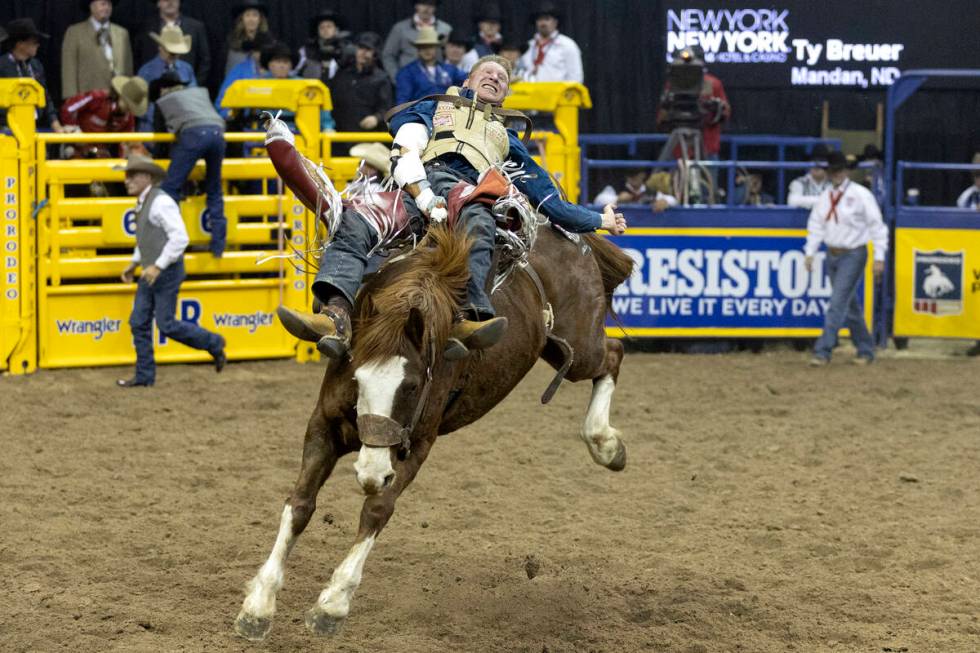 Ty Breuer, of Mandan, N.D., competes in bareback riding during the sixth go-round of the Nation ...