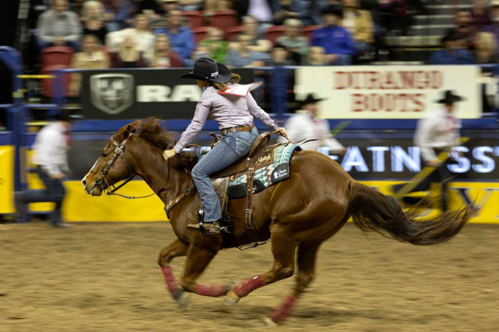 Jordan Briggs, of Tolar, Tex., competes in barrel racing during the sixth go-round of the Natio ...