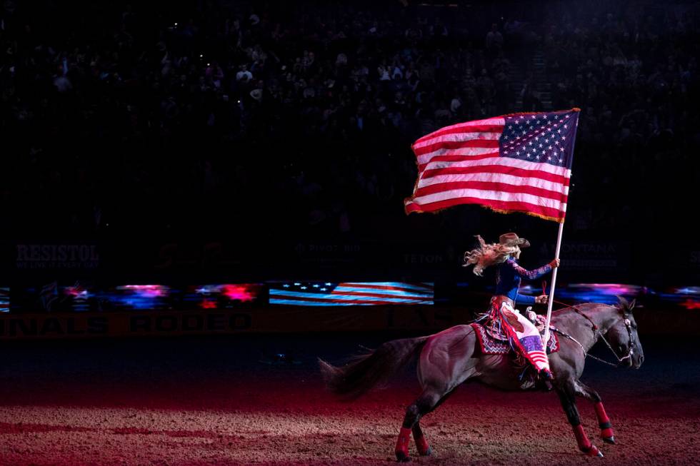 Miss Rodeo America introduces the National Anthem during the sixth go-round of the National Fin ...