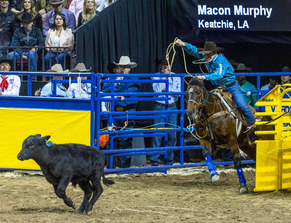 Macon Murphy of Keatchie, LA., leaves the gate during Tie-Down Roping in the National Finals Ro ...