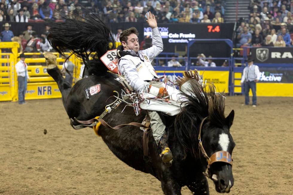 Cole Franks, of Clarendon, Tex., competes in bareback riding during the sixth go-round of the N ...