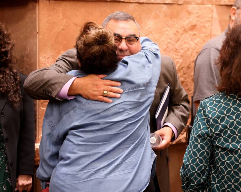 Clark County Registrar of Voters Joe Gloria gets a hug from a supporter after a Clark County Co ...