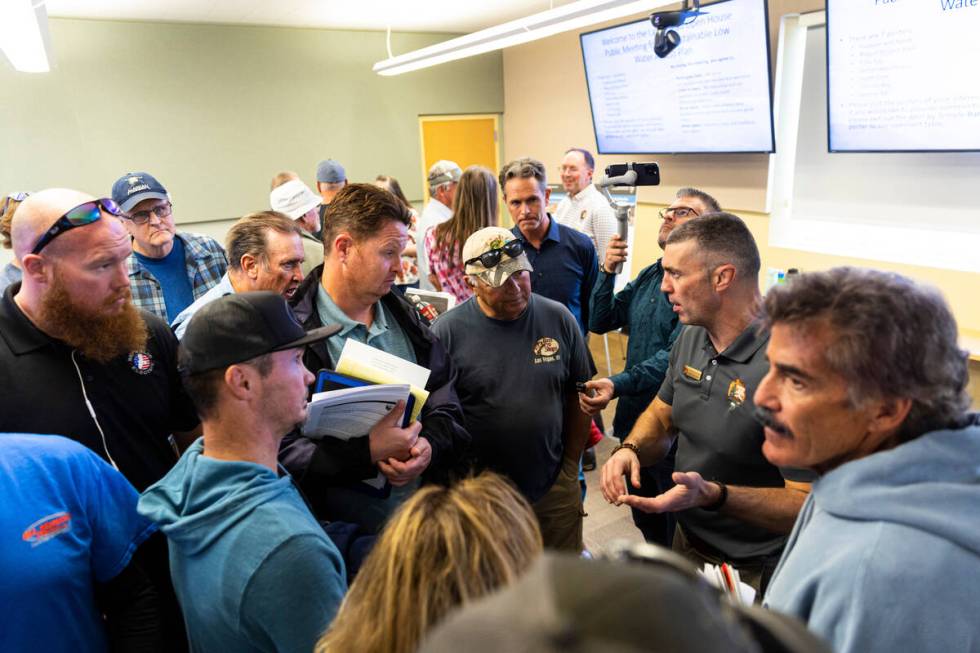 Justin Pattison, deputy superintendent of Lake Mead National Recreation Area, right, speaks wit ...