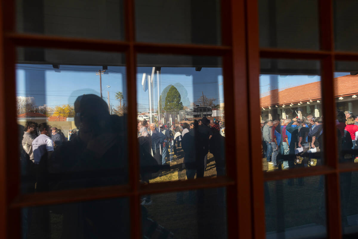 People line up and wait for an open house public meeting for the Sustainable Low Water Access P ...