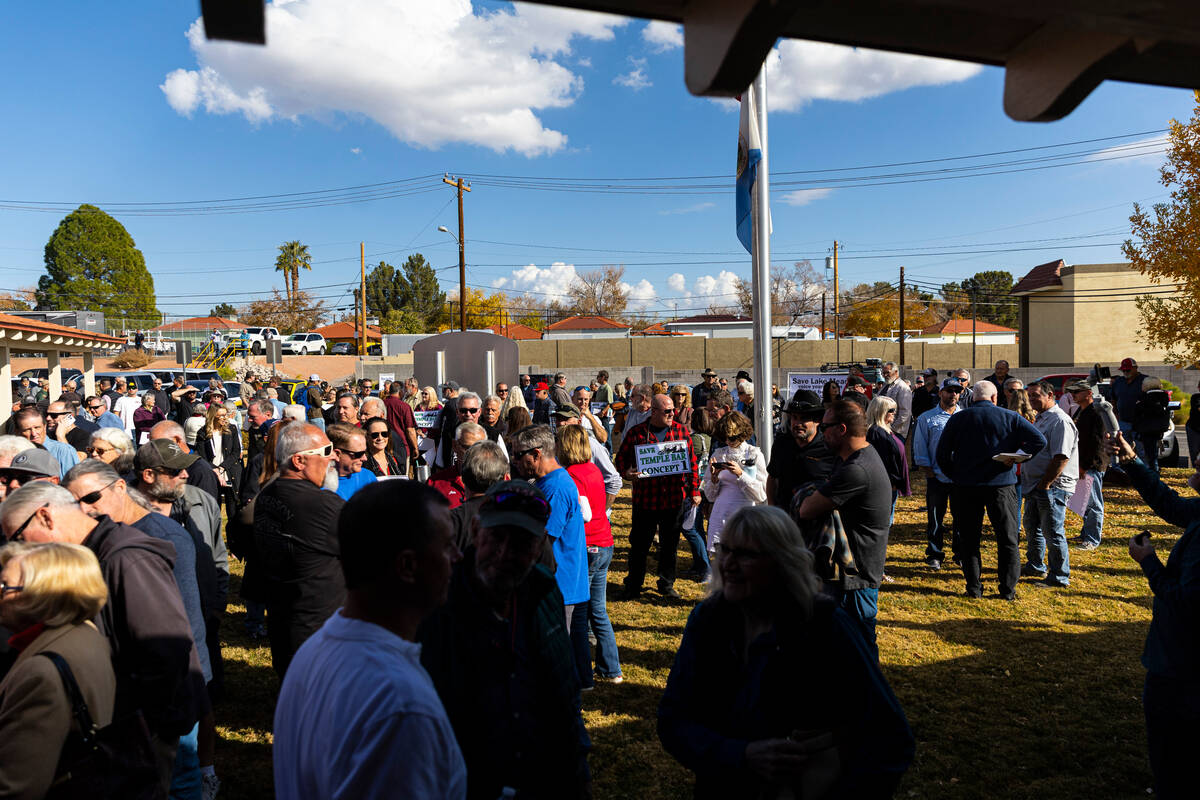 People line up and wait for an open house public meeting for the Sustainable Low Water Access P ...