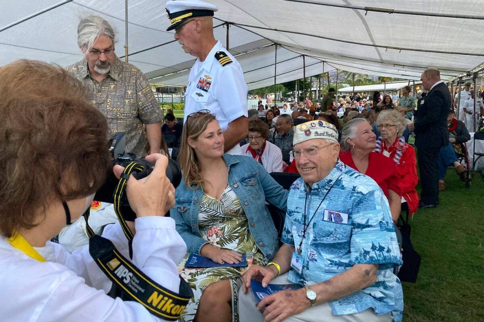 Pearl Harbor survivor Herb Elfring, 100, right, of Jackson, Mich., poses for a photo next to hi ...