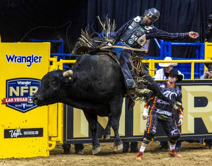 Reid Oftedahl of Raymond, Minn., rides Under The Influence in Bull Riding during the National F ...