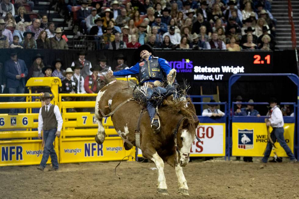 Stetson Wright, of Milford Utah, competes in saddle bronc riding during the eighth go-round of ...