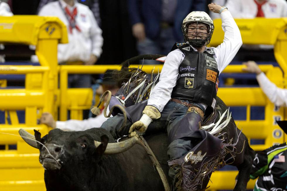 Garrett Smith, of Rexburg, Idaho, competes in bull riding during the eighth go-round of the Nat ...
