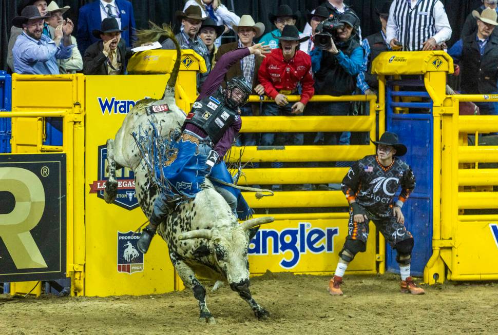 Tristen Hutchings of Monteview, Idaho, hangs tight on his ride in Bull Riding during the Nation ...