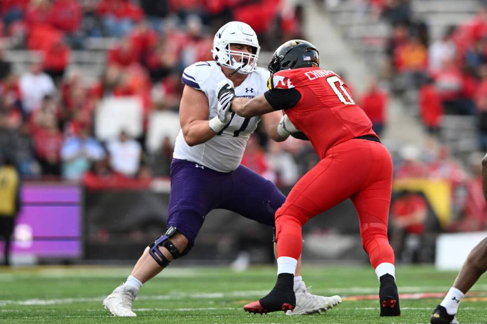 Northwestern offensive lineman Peter Skoronski blocks in an NCAA college football game, Saturda ...