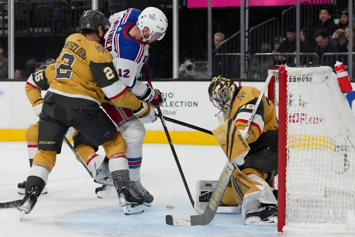 Vegas Golden Knights goaltender Logan Thompson (36) stops a shot attempt by New York Rangers ri ...