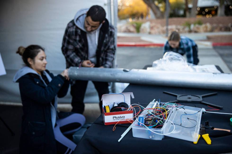 UNLV students Denisse Franco, left, and Ramy Georgi set up their Rain or Shine Sanctuary projec ...