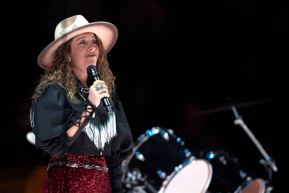 Candace Muir accepts applause after singing the National Anthem during the eighth go-round of t ...