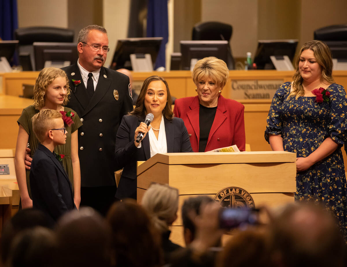 City Councilwoman Francis Allen-Palenske, center, speaks after being sworn in by Mayor Carolyn ...