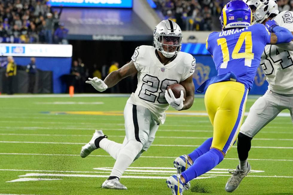 Las Vegas Raiders running back Ameer Abdullah runs with the ball during the first half of an NF ...