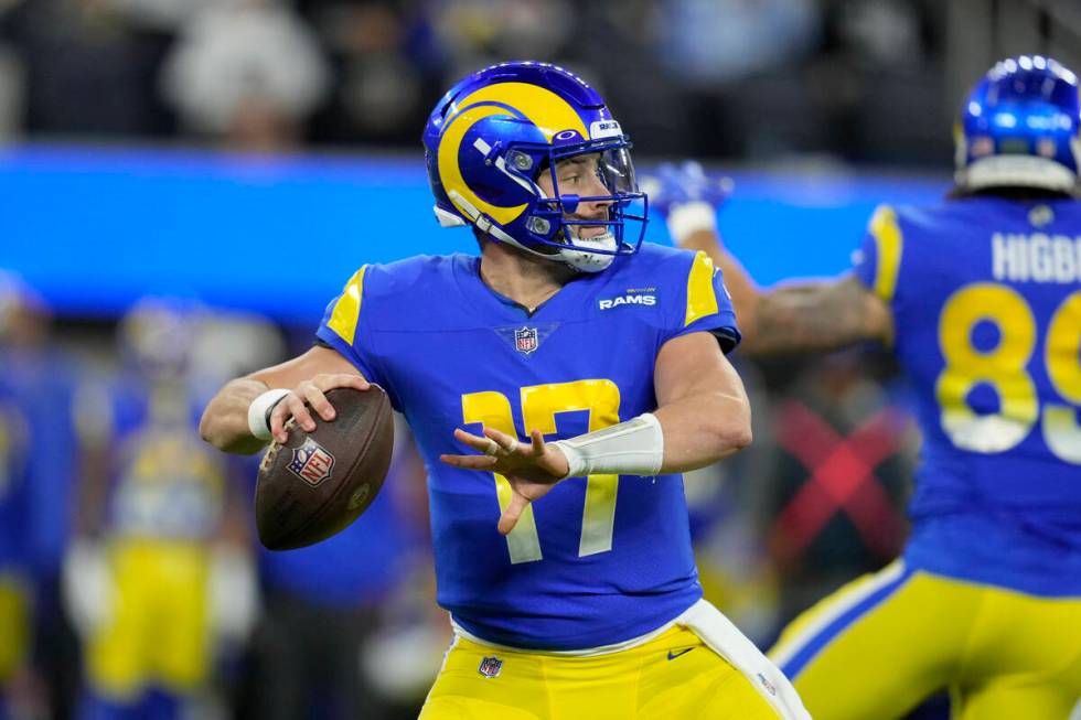 Los Angeles Rams quarterback Baker Mayfield throws a pass during the first half of an NFL footb ...