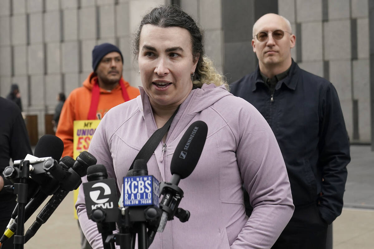 Former Twitter employee Wren Turkal, foreground, speaks during a news conference outside of a f ...