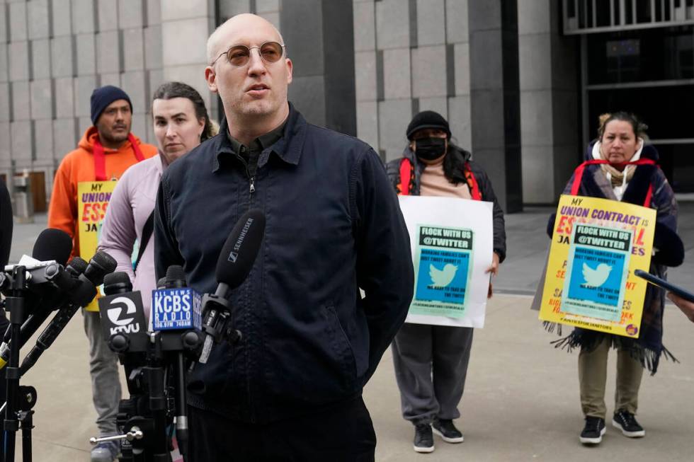 Former Twitter employee Dmitry Borodaenko, foreground, speaks during a news conference outside ...