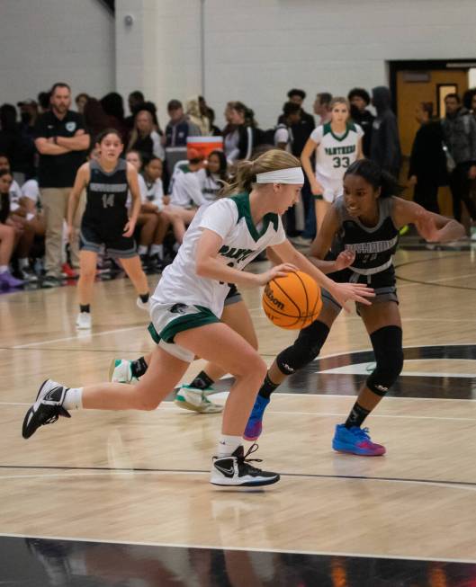 Palo Verde’s Reagan Nehls (10) drives the ball past Silverado’s Ashley Saxton (11 ...