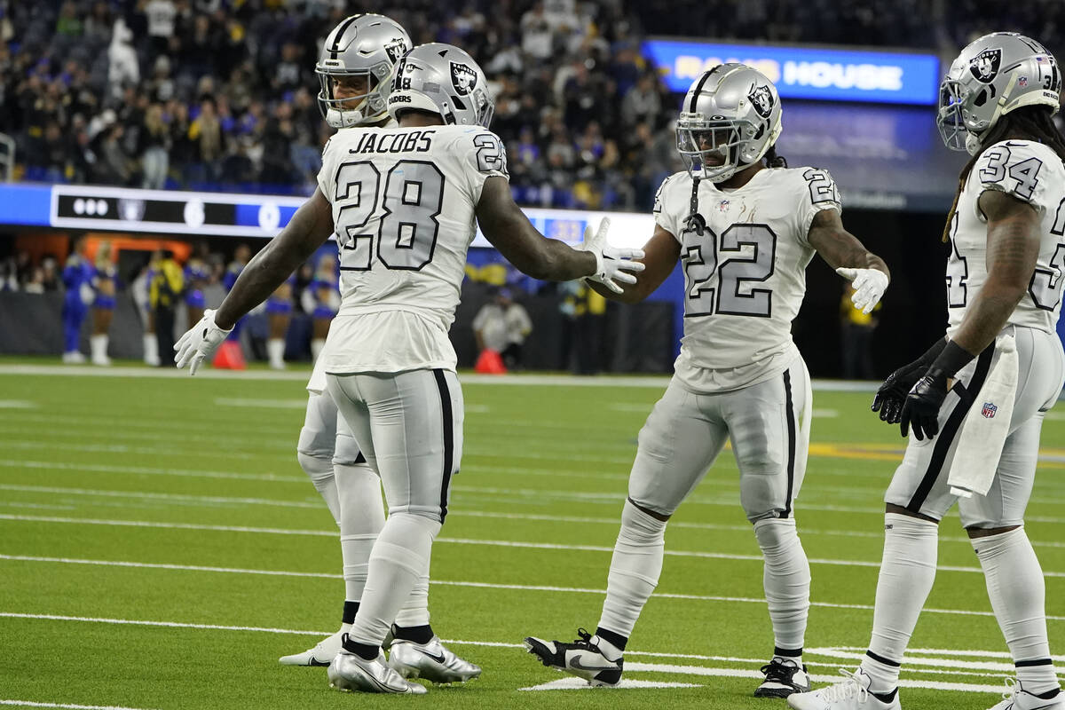 Las Vegas Raiders running back Josh Jacobs (28) celebrates his touchdown with teammates during ...