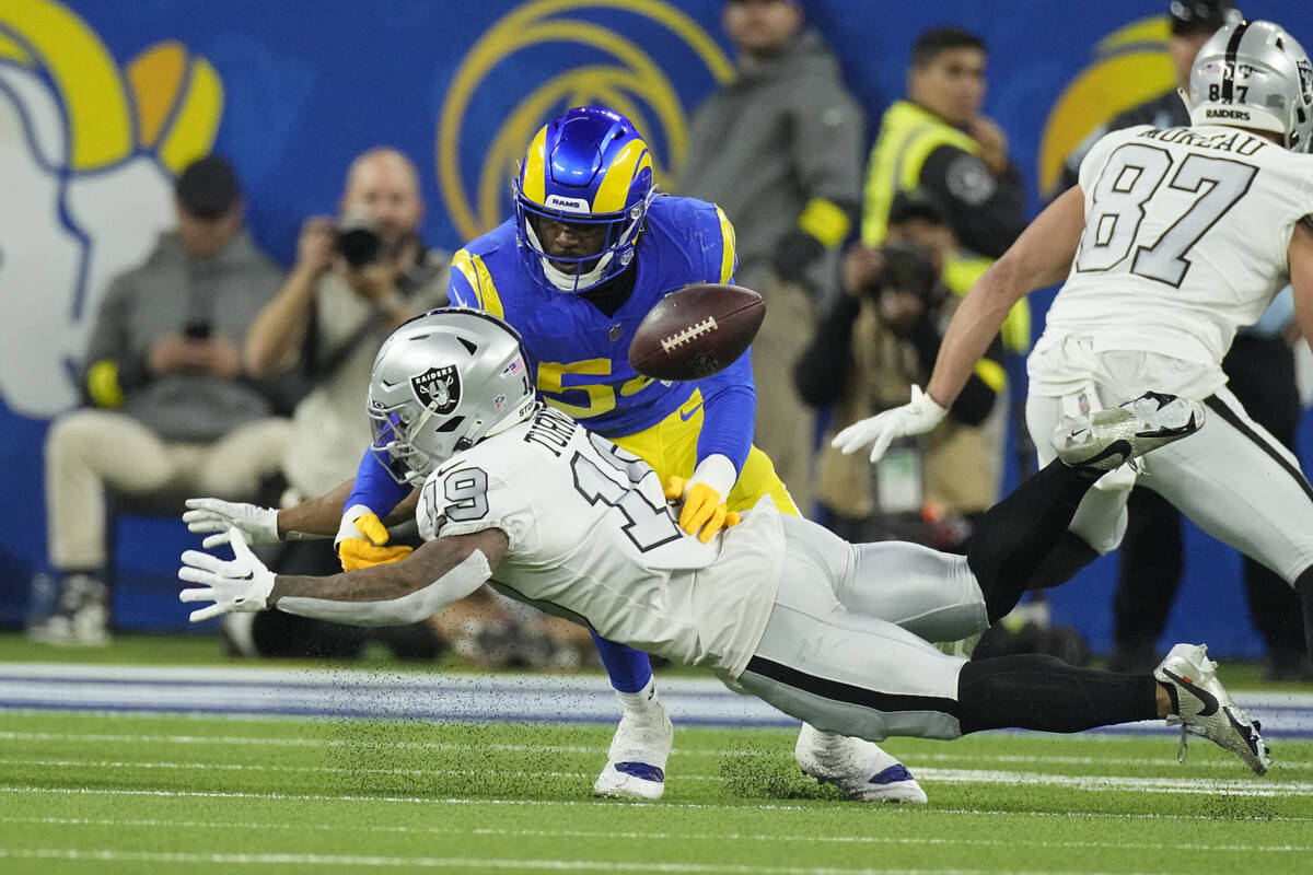 Las Vegas Raiders wide receiver DJ Turner, below, can't make the catch as Los Angeles Rams corn ...