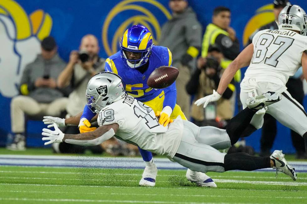 Las Vegas Raiders wide receiver DJ Turner, below, can't make the catch as Los Angeles Rams corn ...