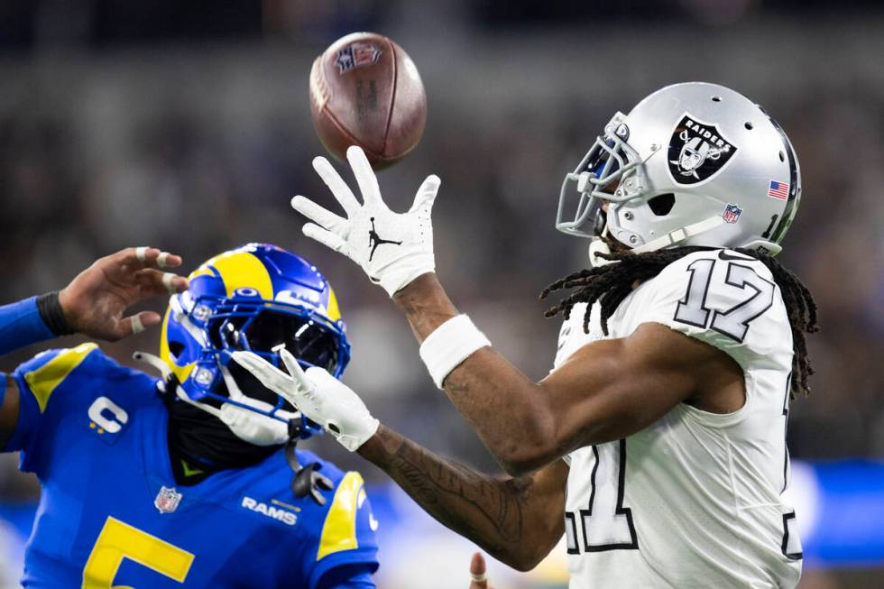 Las Vegas Raiders wide receiver Davante Adams (17) catches a pass over Los Angeles Rams cornerb ...