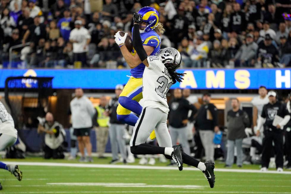 Los Angeles Rams wide receiver Ben Skowronek, above, makes a catch as Las Vegas Raiders cornerb ...