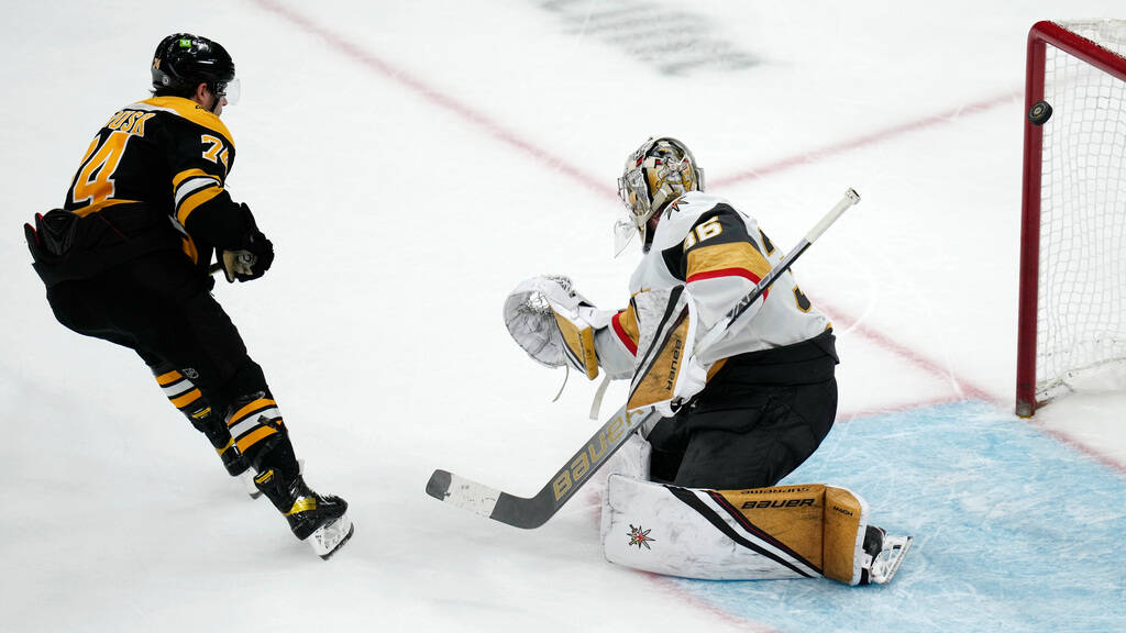 Boston Bruins left wing Jake DeBrusk (74) watches as his shot passes Vegas Golden Knights goalt ...