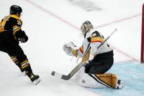 Boston Bruins left wing Jake DeBrusk (74) watches as his shot passes Vegas Golden Knights goalt ...