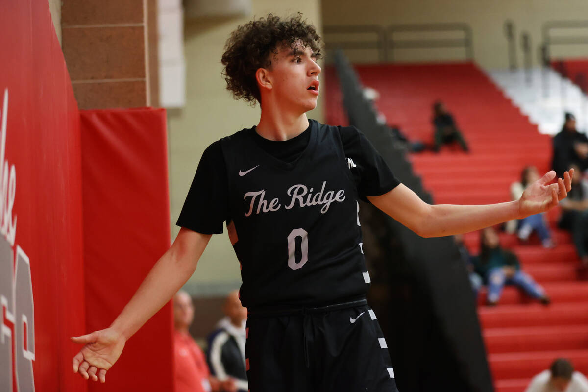 Shadow Ridge's Dylan Pullen (0) reacts after getting called for a foul during a boy's basketbal ...