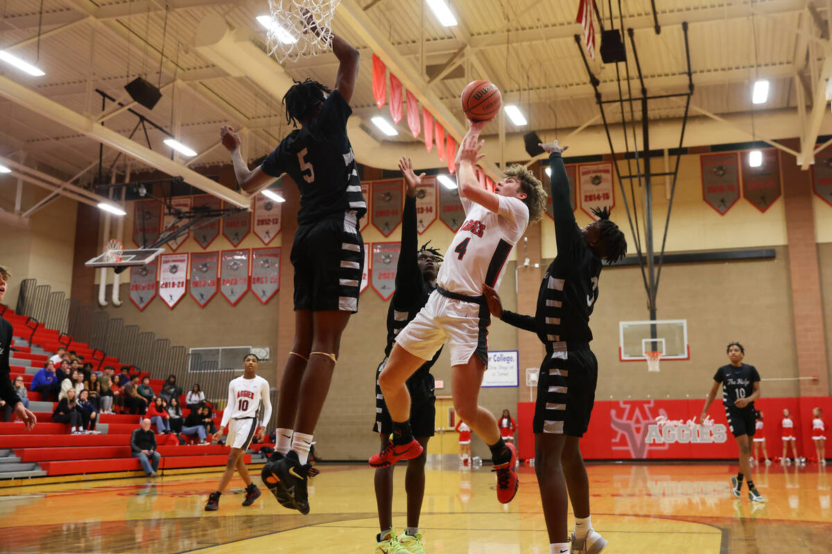 Arbor View's Jalen Dickel (4) takes a shot under pressure from Shadow Ridge's Ron Flenoy (5) du ...