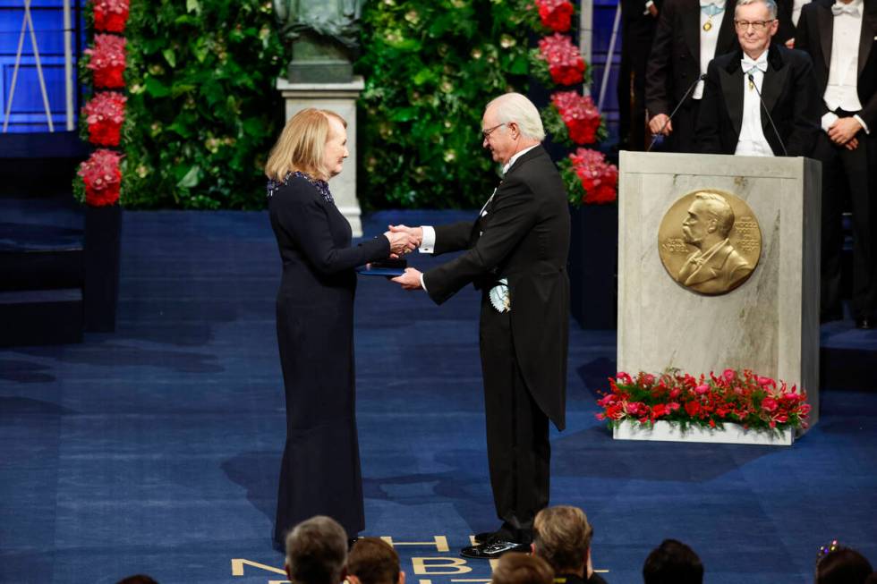 Annie Ernaux receives the 2022 Nobel Prize in literature from King Carl Gustaf of Sweden during ...