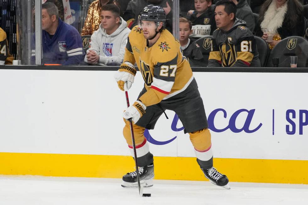 Vegas Golden Knights defenseman Shea Theodore (27) plays against the New York Rangers during an ...