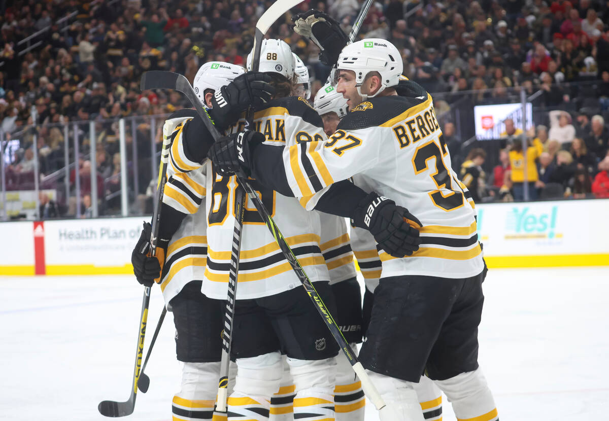 The Boston Bruins celebrate after scoring against the Golden Knights during the second period o ...