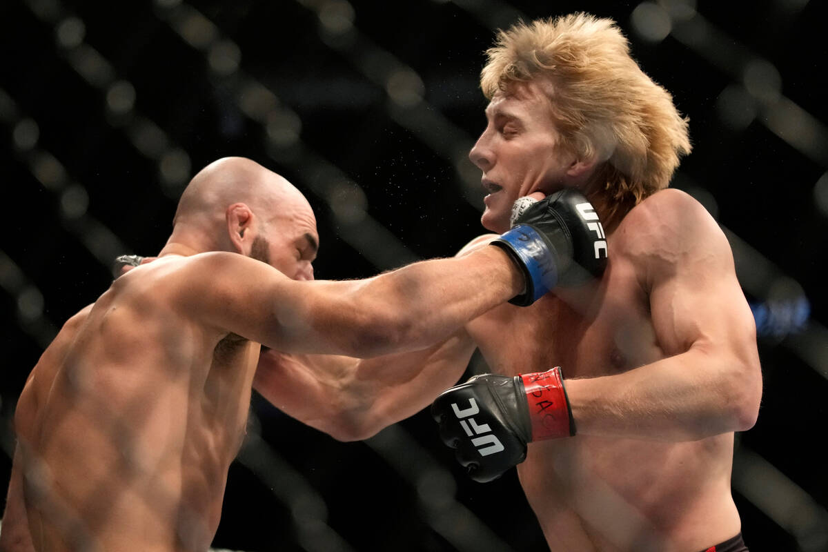 Paddy Pimblett, right, fights Jared Gordon during a UFC 282 mixed martial arts lightweight bout ...