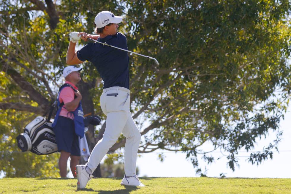 Maverick McNealy, of Las Vegas, watches his drive to the sixteen green during the first round o ...