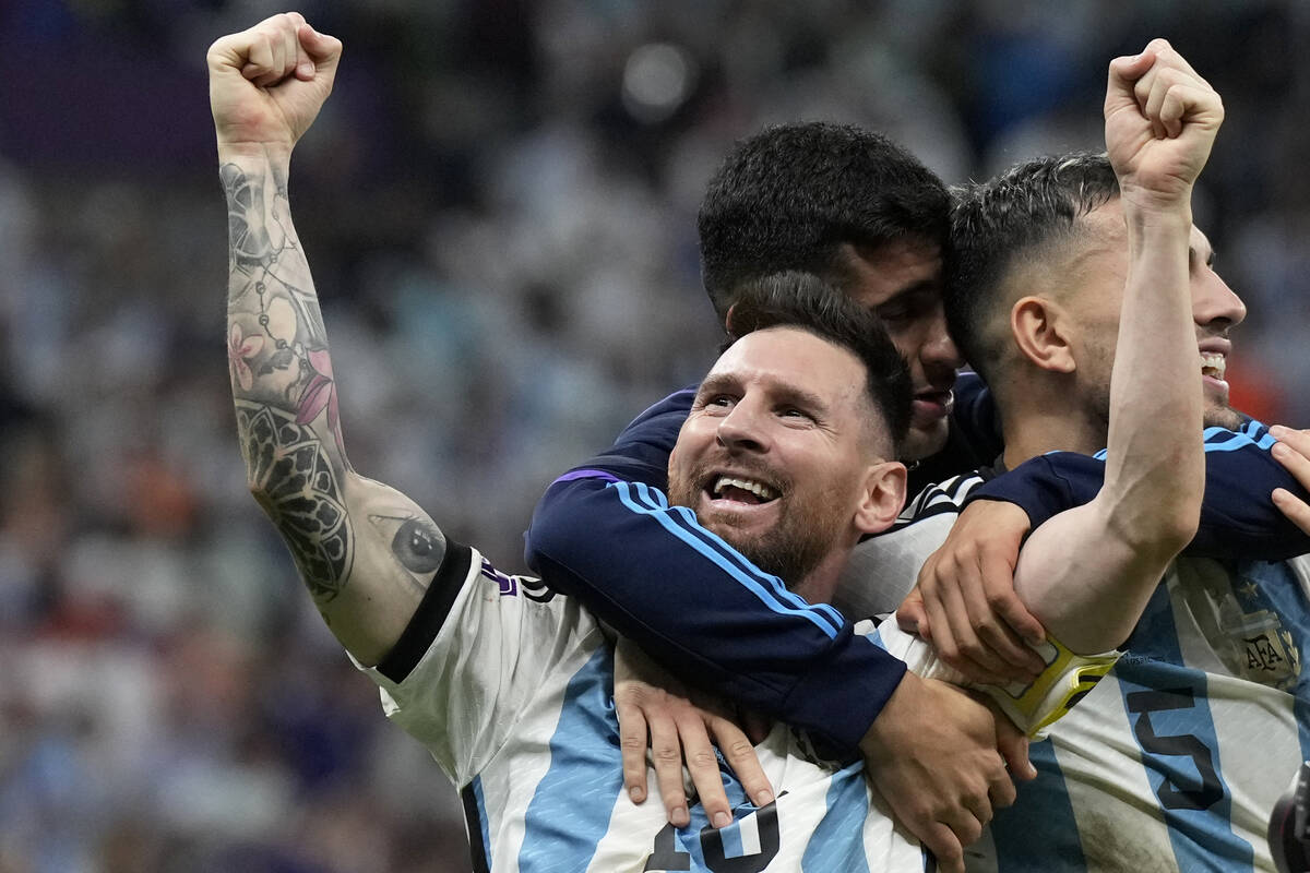 Argentina's Lionel Messi celebrates at the end of the World Cup quarterfinal soccer match betwe ...
