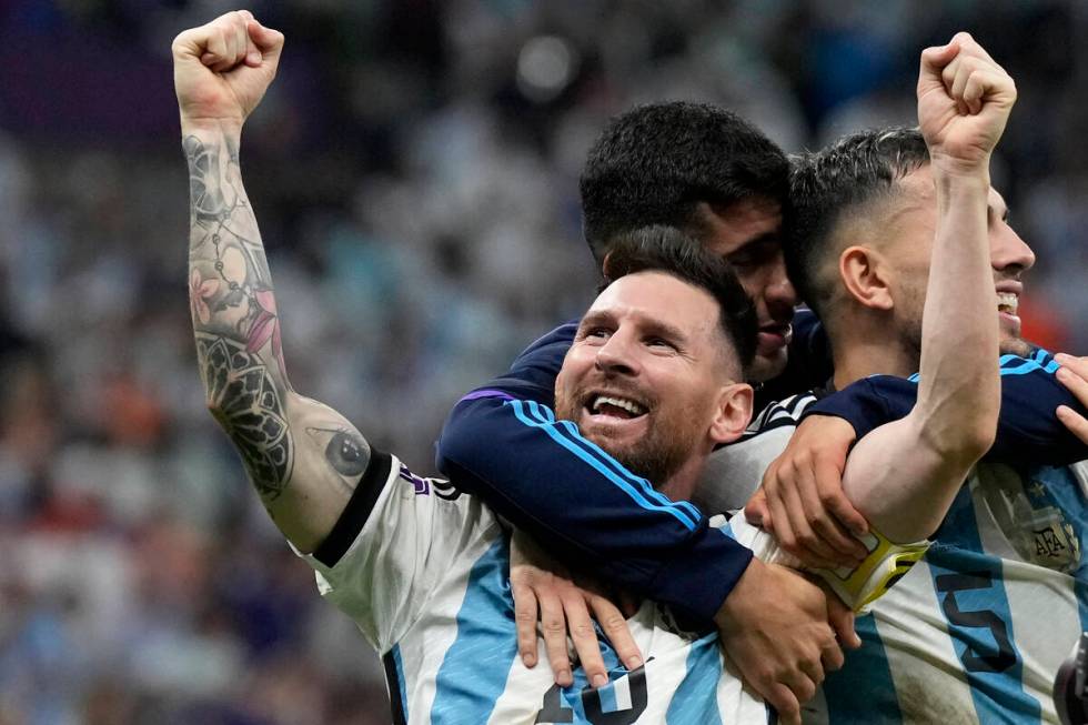 Argentina's Lionel Messi celebrates at the end of the World Cup quarterfinal soccer match betwe ...