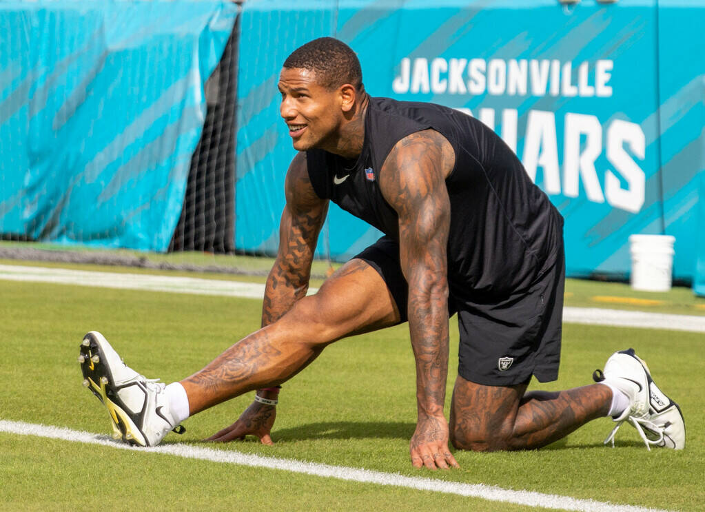 Raiders tight end Darren Waller stretches before an NFL game against the Jacksonville Jaguars a ...