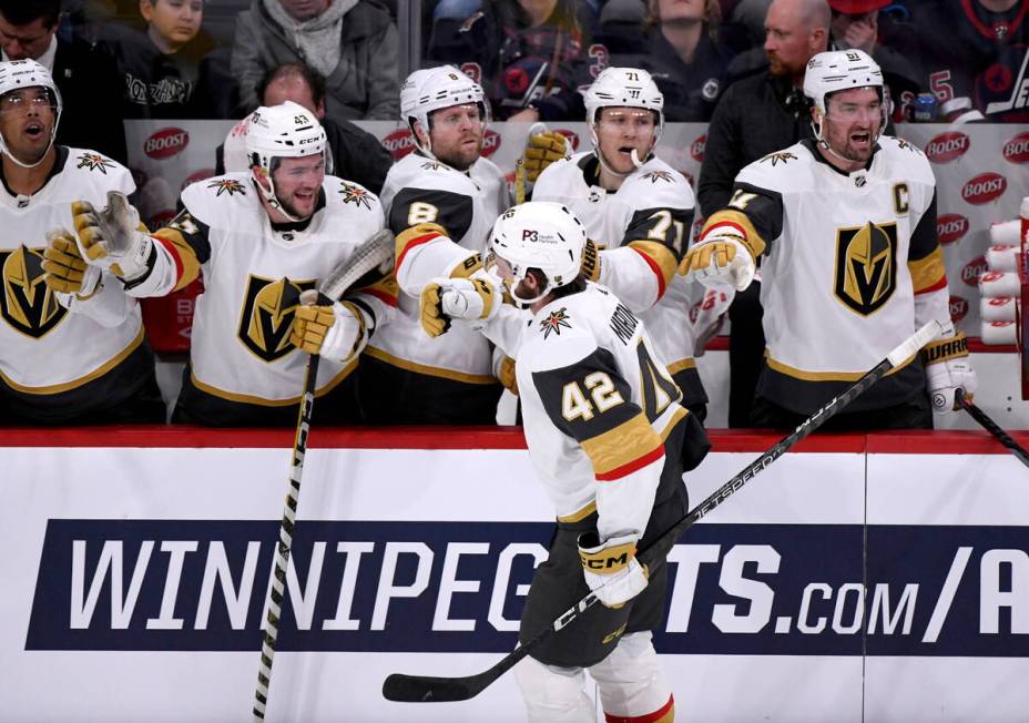 Vegas Golden Knights' Daniil Miromanov (42) celebrates his goal against the Winnipeg Jets with ...