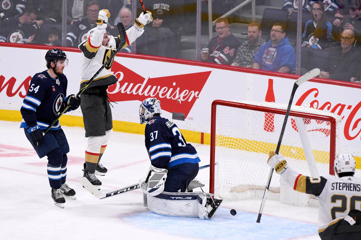 Vegas Golden Knights' Mark Stone (61) celebrates the goal by Jonathan Marchessault, not shown, ...