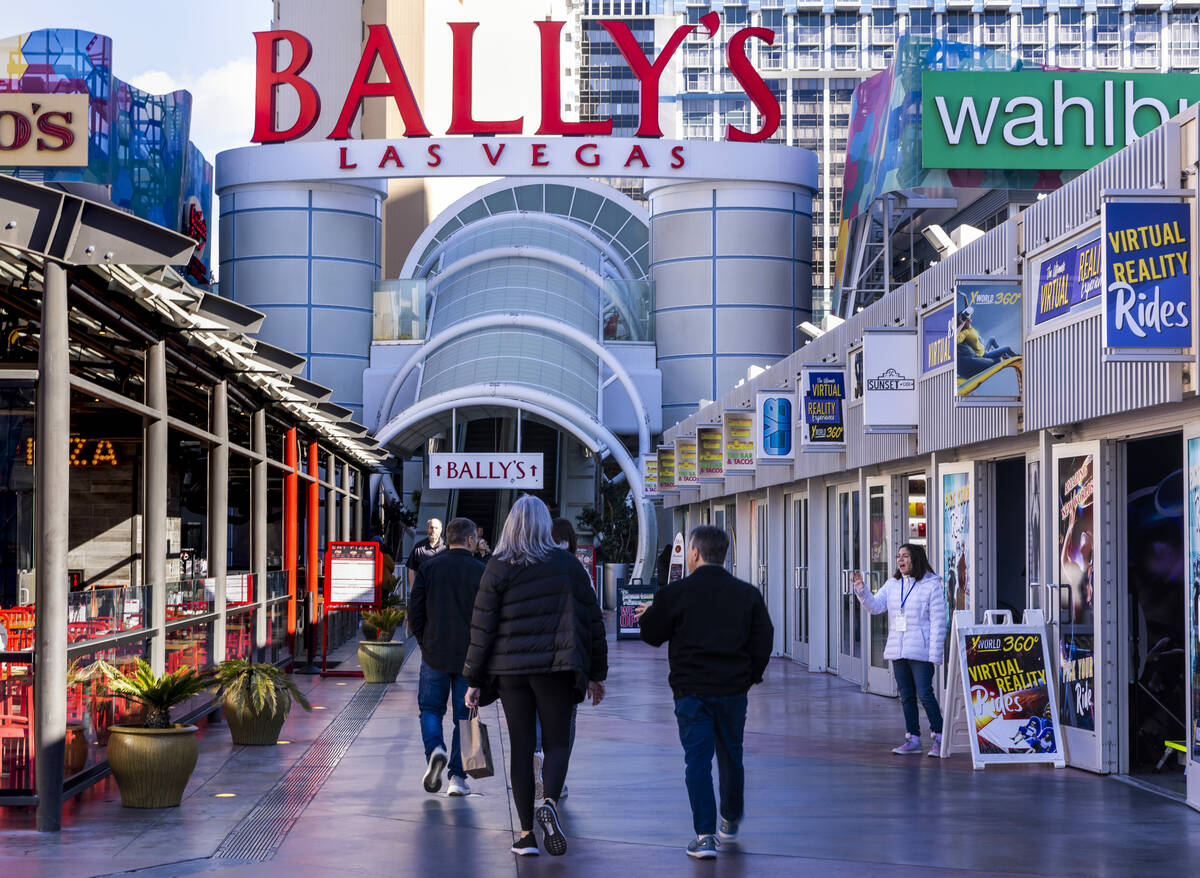 Visitors walk about the the Grand Bazaar Shops outside Horseshoe Las Vegas (formerly Bally's), ...