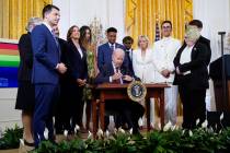 FILE - President Joe Biden signs an executive order at an event to celebrate Pride Month in the ...