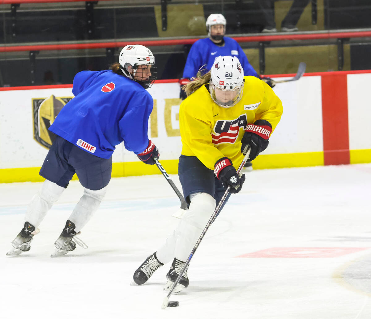 Forward Hannah Brandt (20) of the U.S women's national hockey team moves the puck past forward ...