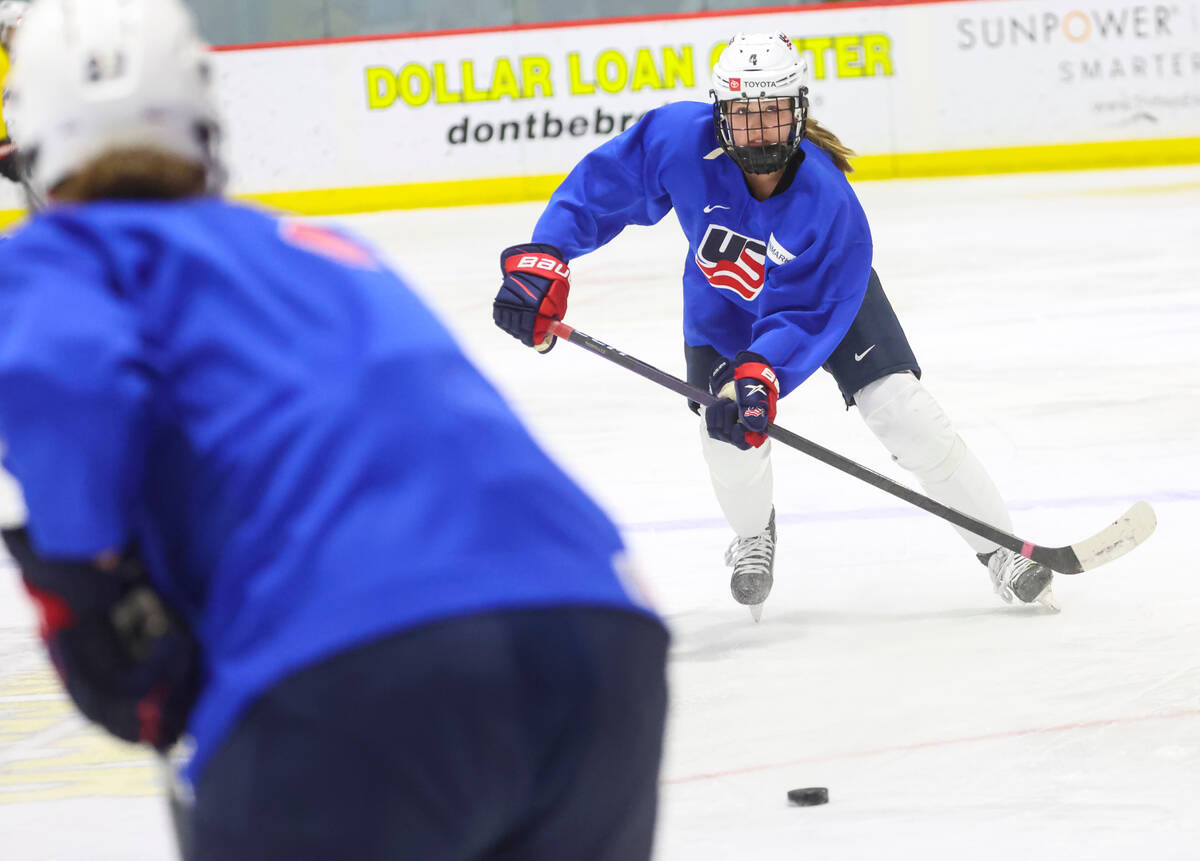 Caroline Harvey of the U.S women's national hockey team passes the puck during practice at Life ...