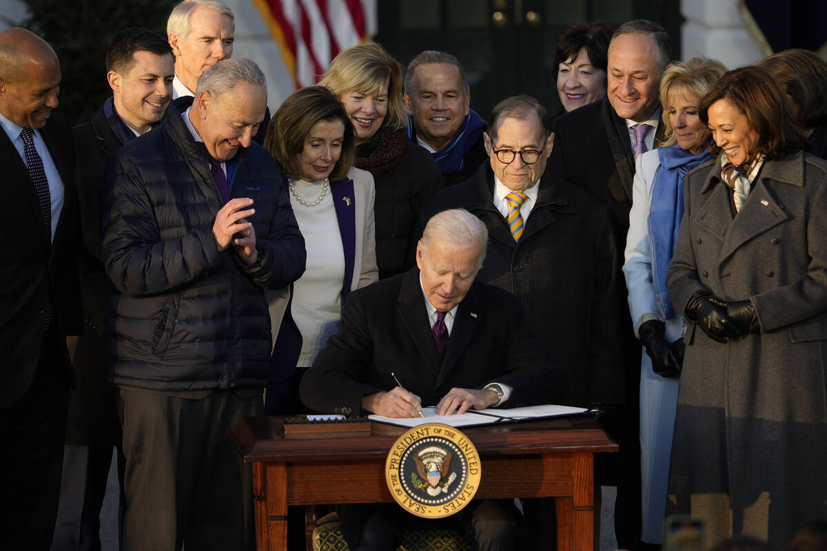 President Joe Biden signs the Respect for Marriage Act, Tuesday, Dec. 13, 2022, on the South La ...